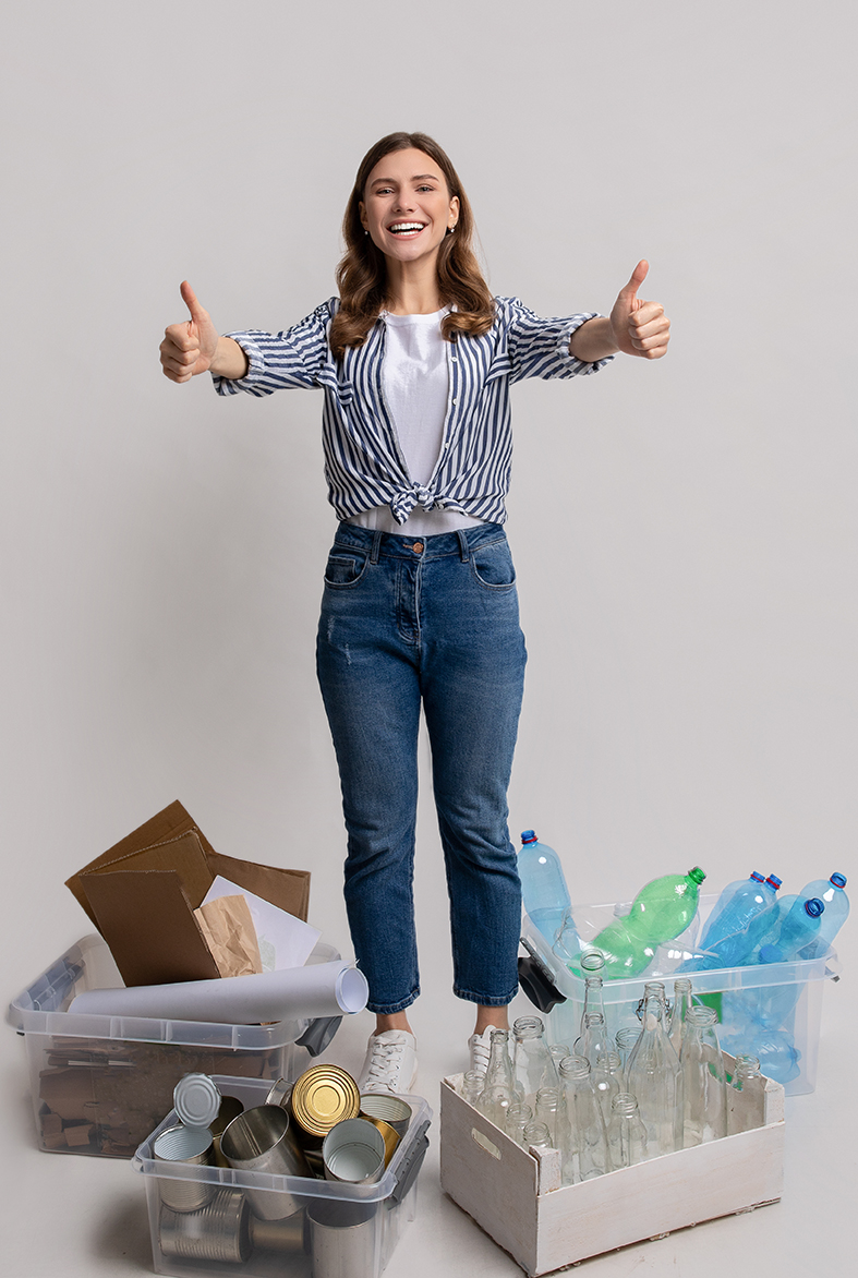 Materials Recycling Concept. Happy Woman Standing Next To Containers With Different Waste